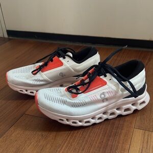 On Running White and Red Athletic Shoes